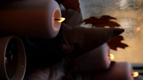 Cozy Still Life with Candles, Mugs and Autumn Leaves