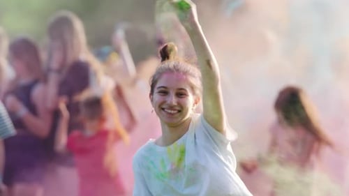 Happy Woman Covered in Holi Color Powder Smiling