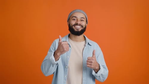 Happy African American Man Shows Thumbsup Encouragingly