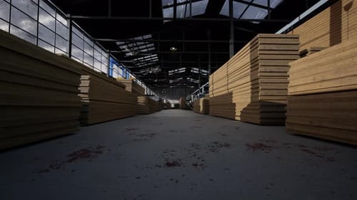 Tablas de madera apiladas en un gran almacén industrial