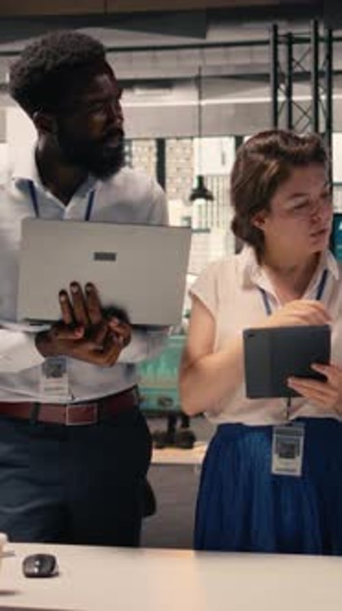 Vertical Video Portrait Multiethnic Team Working Together in Office Review Business Reports