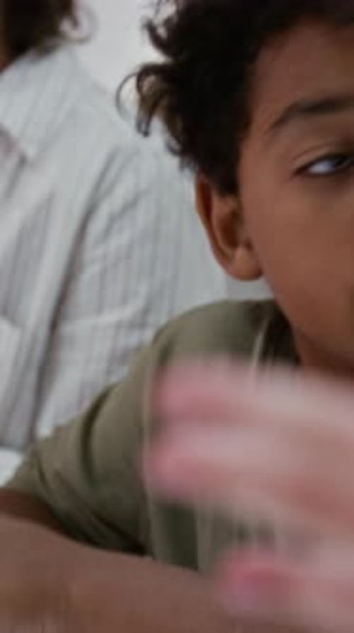 Child and Adult Playing with Modeling Clay Together