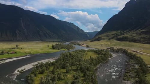 Aerial View of the Beautiful Valley and River Surrounded By High Mountain Ranges