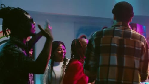 Adults Dancing and Celebrating at Birthday Party