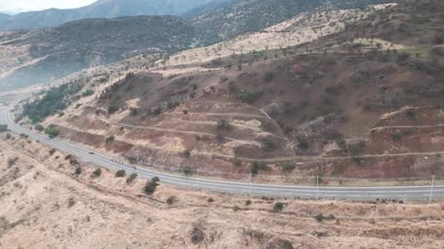 cyclists on a hill pedaling in the municipality of Barnechea, Chile