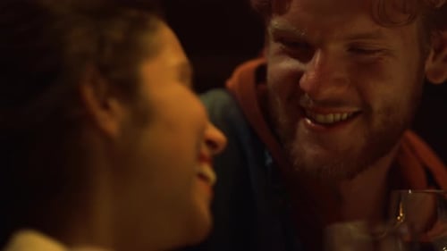 Romantic Couple Laughing Together During Wine Date