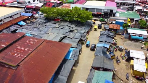 Orbital drone shot of a market in the town