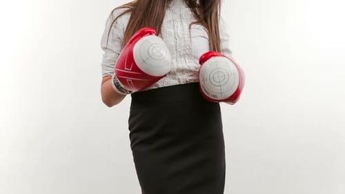 Business Woman Boxing Punching Towards Camera Ready to Fight