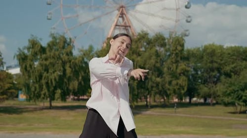 Girl Dancer Dancing Energetic Dance on the Street in Urban Atmosphere
