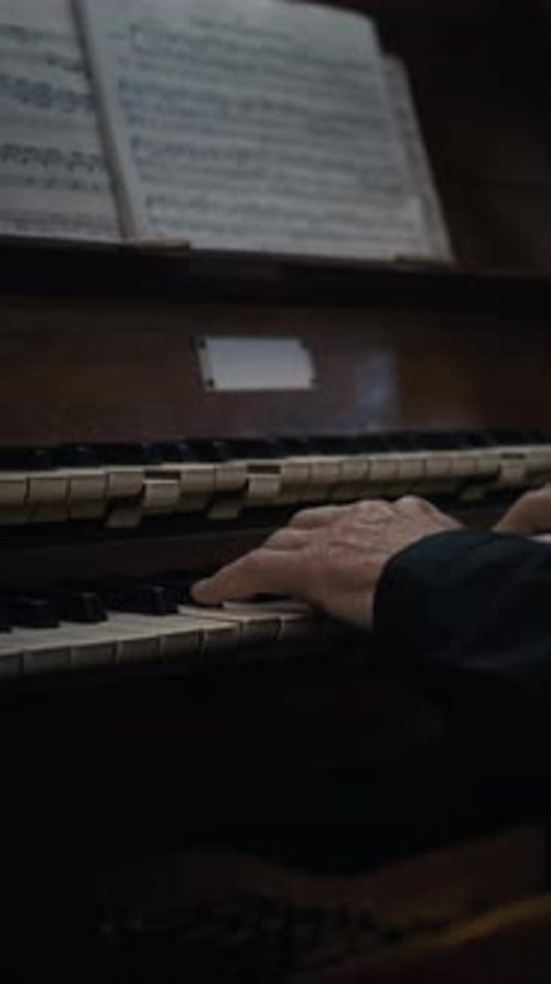 Close-up of Hands of Unknown Male Musician Playing Organ Keyboard