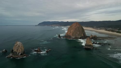 Aerial Shot of Haystack Rock Beach in Coastal Town Cannon Beach Oregon