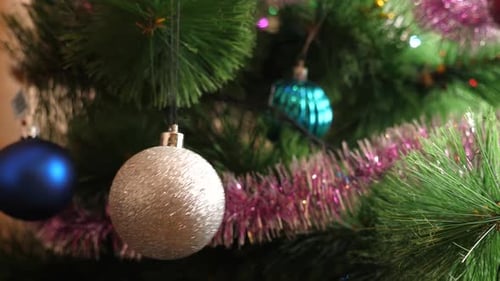 Sparkling Christmas Ornaments on a Decorated Tree
