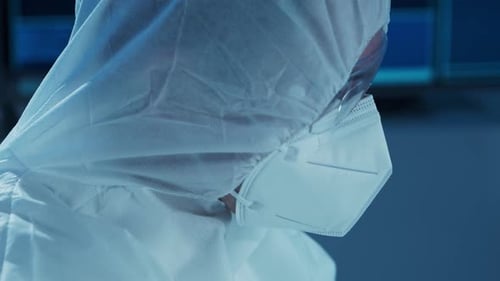 Microelectronics Engineer Works in a Modern Scientific Laboratory on Computing Systems and