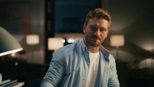 Focused Man Working Late at Night from Home