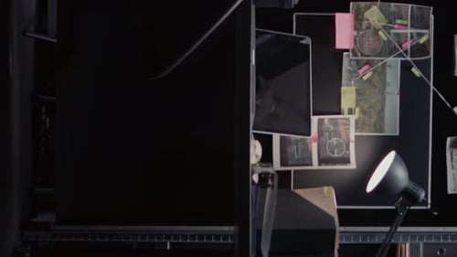 Crime Investigation Board with Tablet Computer and Photos