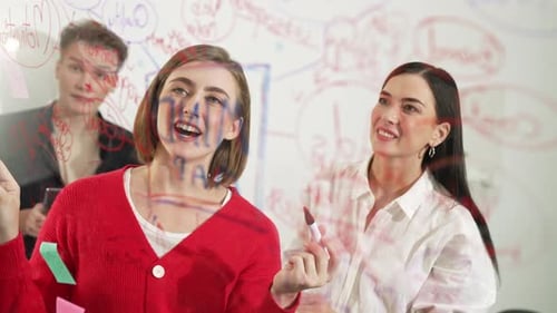 Creative Team Brainstorming Together at a Whiteboard