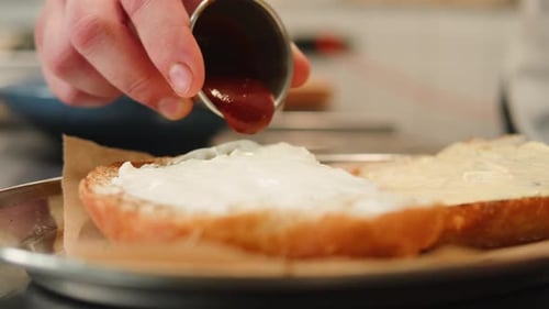 Close Up Food Preparation of Burger with Sauce