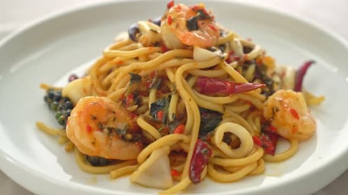 Delicious Spaghetti with Shrimp and Squid Rings Close Up