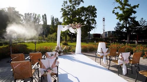 Outdoor Wedding Venue Set Up with Floral Arch