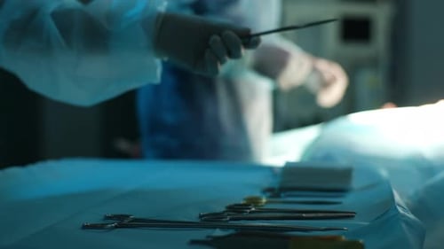 Surgical Team Preparing Instruments in Operating Room