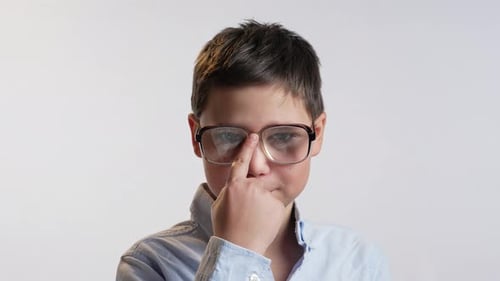 Smiling Child with Eyeglasses Poses for Camera