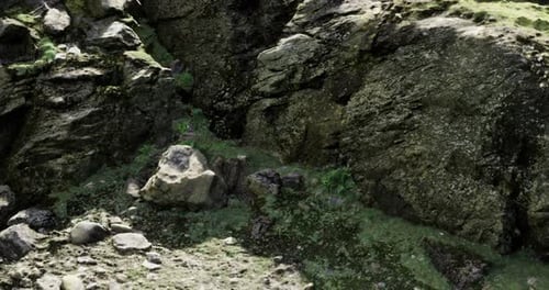Exploring the Rugged Terrain of a Moss Covered Rocky Landscape in Nature