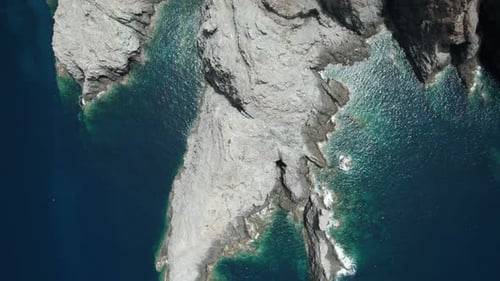 (Top Down View) Aerial view fly over drone over sea cliff with powerful sea waves and torquoise wate