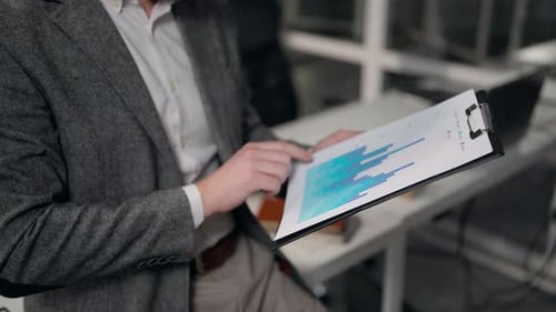 Close Up Male Hands Holding Tablet Folder Paper Reviewing Charts Unrecognizable Business Man Reading