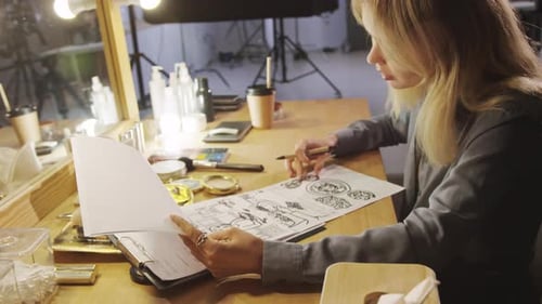 Woman with Blonde Hair is Working on Art