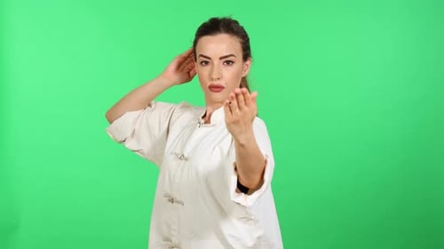 Woman Performing Martial Arts on Green Screen
