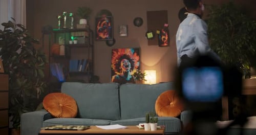 Motivational Speaker or Public Speaking Coach African Woman in Her Living Room Confidently Speaks to