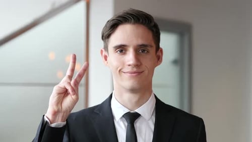 Thumbs Down By Businessman in Office