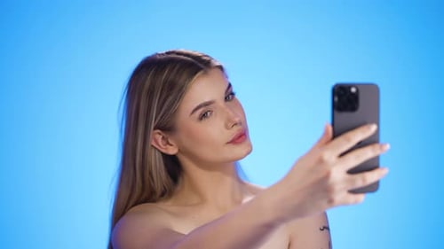 Young female taking selfie