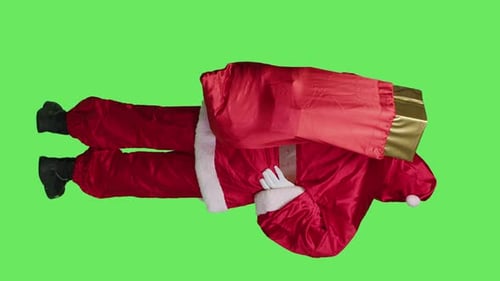 Vertical Video Back View of Santa Claus Having Backpain on Camera