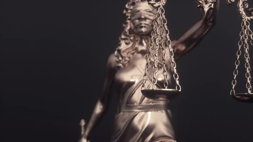 Close-up Shot of Scales that Lady Justice is Holding. Legal and law concept statue of Lady Justice
