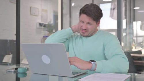Man with Neck Pain at Office Desk