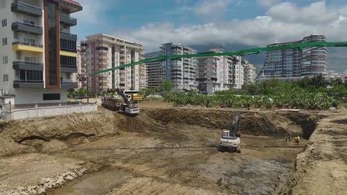 Aerial View First Concrete Poured Heavy Machinery Begins New Construction