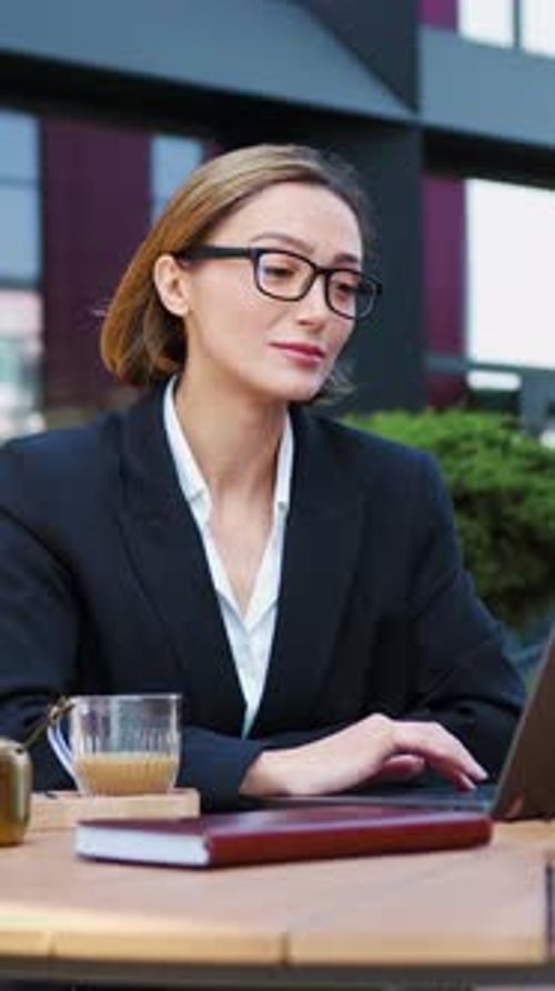 Close Up Portrait Smiling Face Business Woman Looking at Camera Wearing Stylish Glasses Sipping