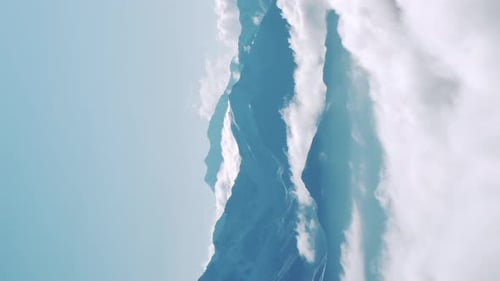 Dramatic Mountain Peak Surrounded by Clouds