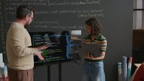 Schoolgirl Presenting Coding Project on Screen and Debating with Teacher