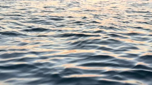 Aerial, waves and ripples at beach in nature for travel location, tropical adventure