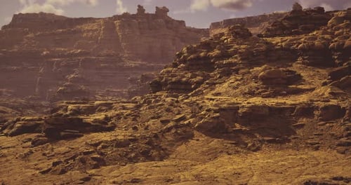 Exploring Rugged Terrain in a Majestic Canyon Under Cloudy Skies