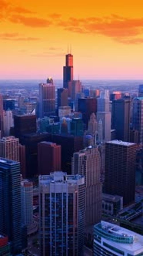 Futuristic Chicago downtown scenery at the backdrop of orange sky.