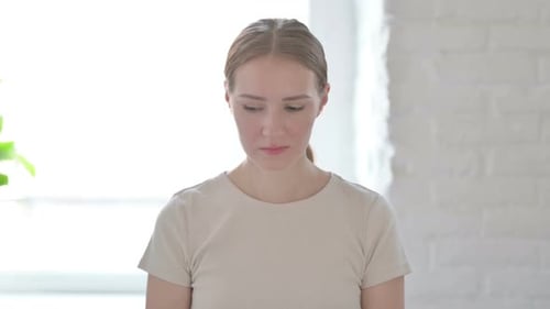 Young Adult Woman Looking Sad Indoors