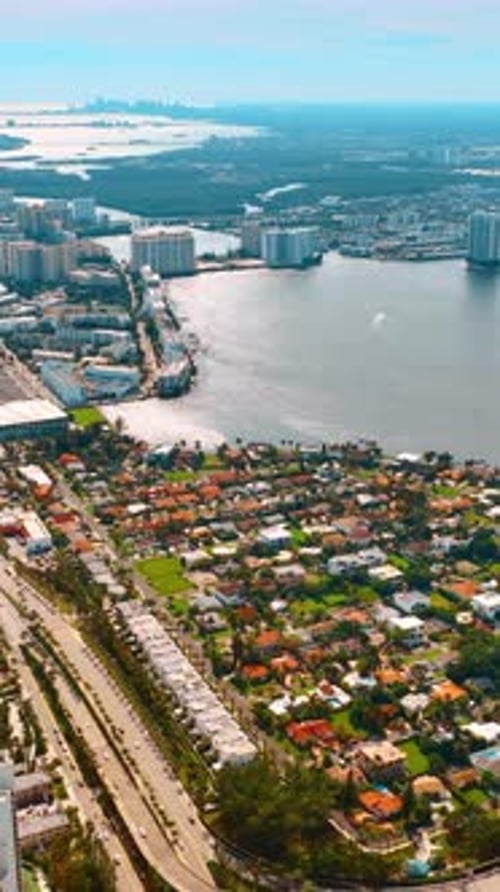 Scenic view of sunny Miami Beach. Top perspective of beautiful islands from drone footage.