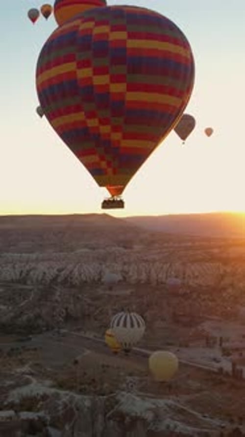 Vertical Aerial View of Hot Air Balloons Flying Above Goreme, Cappadocia Turkey at Sunrise