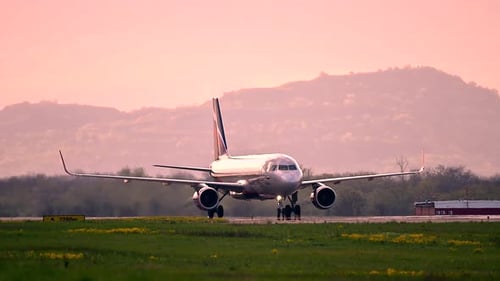 Huge Airplane Jet Maneuvering After Landing at International Airport Landing Zone at Beautiful