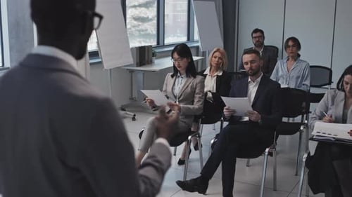 Professional Presentation by Colleagues in Bright Office Setting