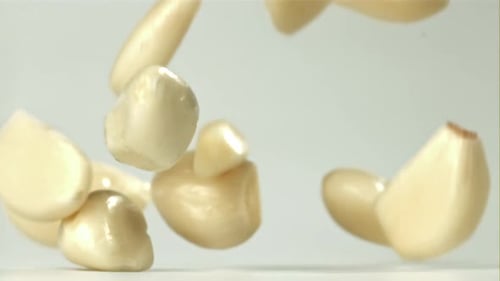 Fresh Garlic Falls on the Table Filmed on a Highspeed Camera at 1000 Fps