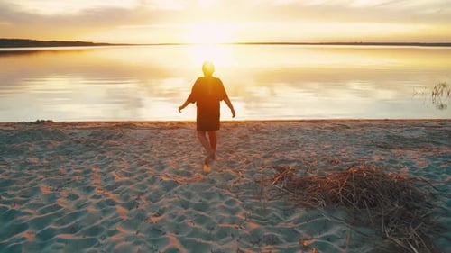 Teenage Girl Runs Into Lake Water at Sunset Joyful Sunset at Lake A Serene Summer Experience That